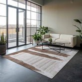 Luxury abstract rug in earthy brown and grey tones, hand-tufted wool rug with layered stripe and irregular edges.